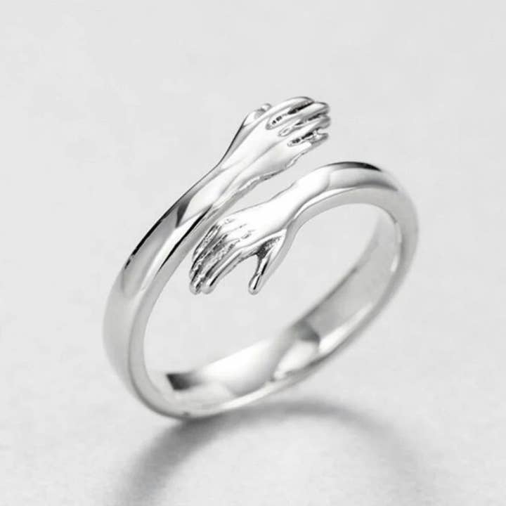 Hugging hands silver color ring