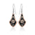 Black background retro floral earrings